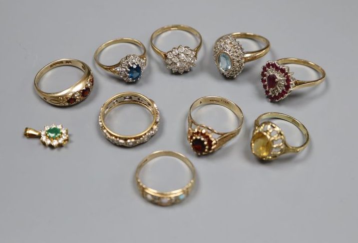 Seven assorted 9ct gold and gem set rings and a pendant, gross 20.8 grams, an 18ct gold ring and one other,